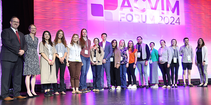 Residents standing on stage posing for photo