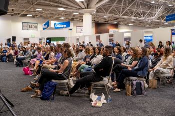 Rows of attendees watching session