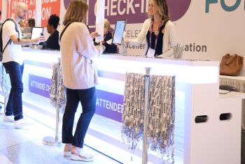 Lanyards in front of a person checking in