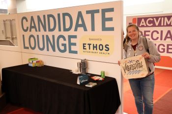 Person holding bag in front of Candidate Lounge