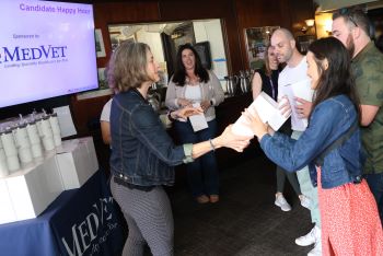 Sponsor handing out mugs