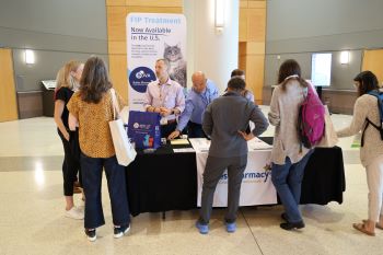 attendees visiting sponsor table