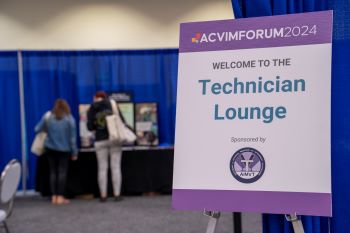 Technician Lounge sign with people at a table in the background